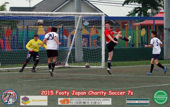 Theo goes up for the header - Footy Competitions Japan Charity Soccer 7s 2015